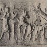 Human-headed winged lion (lamassu, sphinx) in front of hero grasping bull behind him