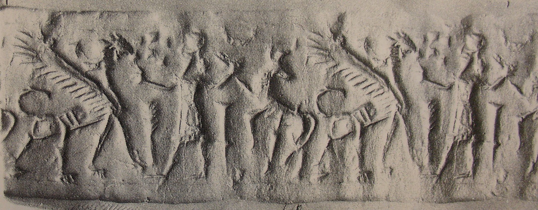 Human-headed winged lion (lamassu, sphinx) in front of hero grasping bull behind him