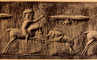 Horse-riding Median spearman hunting boar below a winged sun-disc