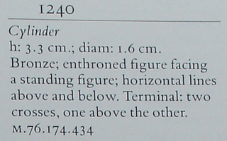 Enthroned figure faced by standing figure