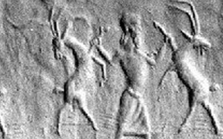 Hero grasping wild goat (ibex) on either side