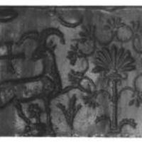 Mouflon striding towards stylised tree