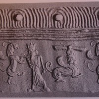 Stamp-cylinder seal: Royal hero fighting rampant lion-dragon beside human-headed winged lion (shedu, sphinx) under winged sun-disc (cylinder image) – Wild goat (ibex) under crescent moon (stamp image)