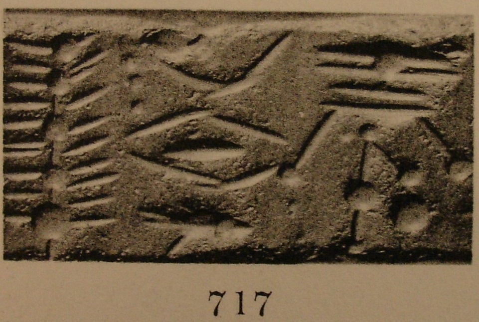 Stylised tree, winged sun-disc, and various other motifs and symbols
