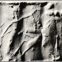 Hero fighting human-faced winged wild goat (ibex) beside worshipper